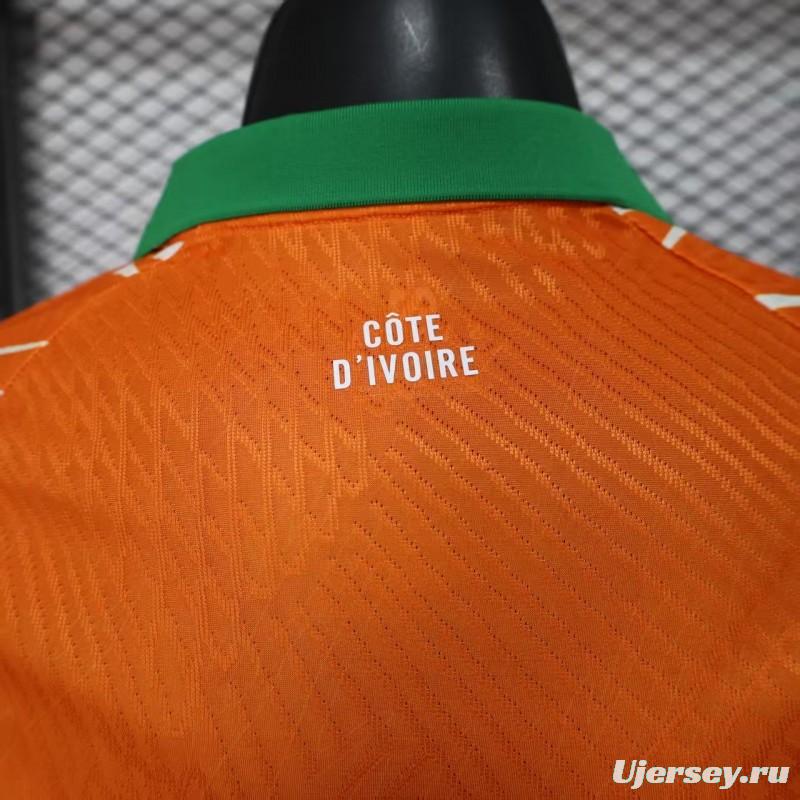 Player Version 2025 Ivory Coast Orange with Elephant Graphic and Green Accents Jersey